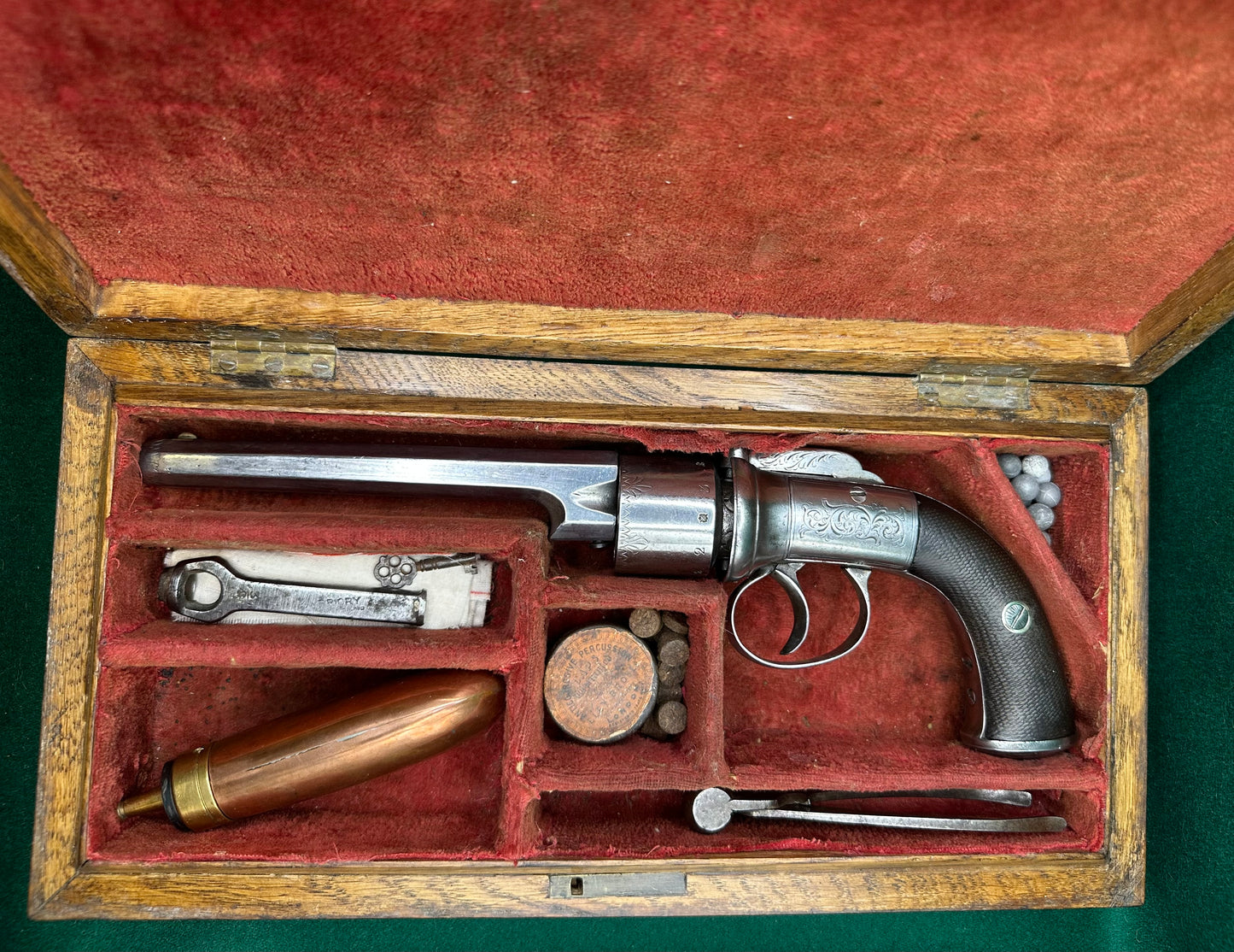 A large Oak Cased Percussion Cap Transitional Revolver